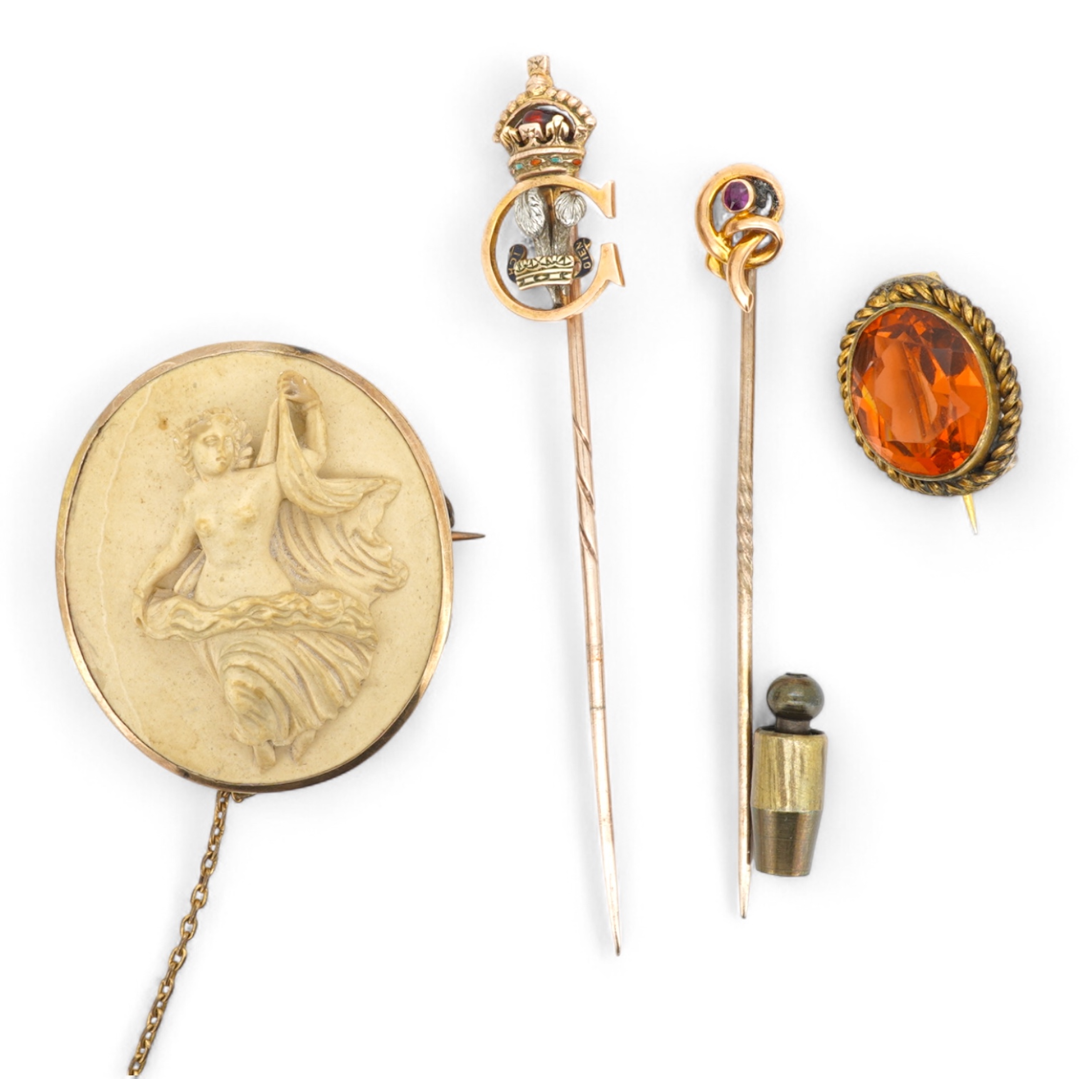 A collection of jewels, comprising: a stick pin, capped with the 'C' cipher with crowned ostrich feather and 'Ich Dien' motto for King Charles when Prince of Wales, in varicoloured gold and enamel, length 6.9cm, gross we